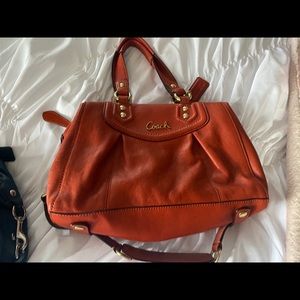 Burnt orange coach purse